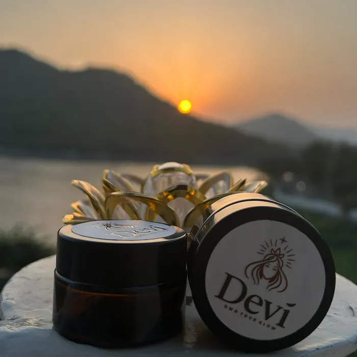 Shakti jars with a lotus holder at sunset over a lake in Udaipur